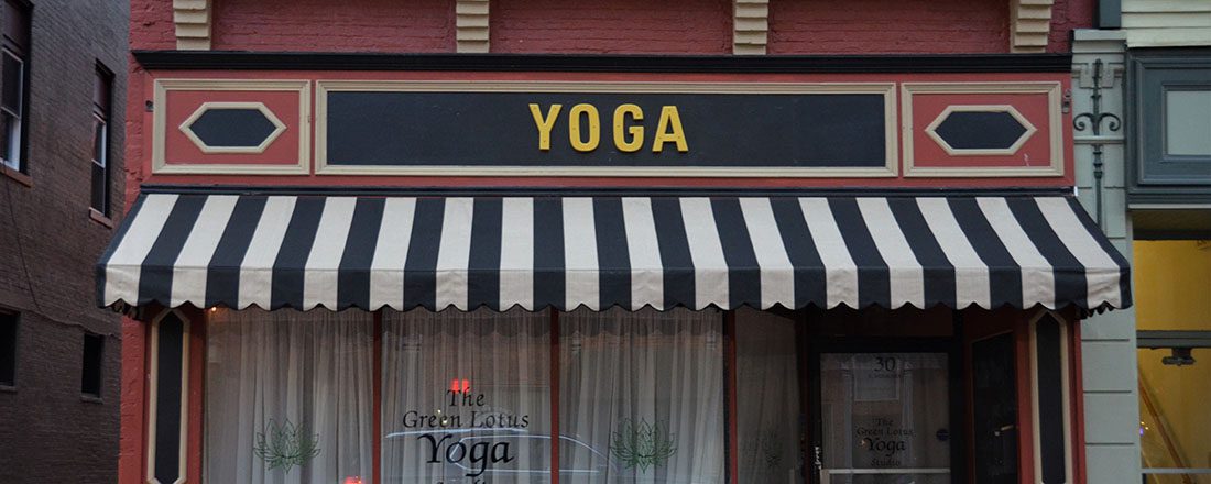 black and white striped awning on a yoga studio