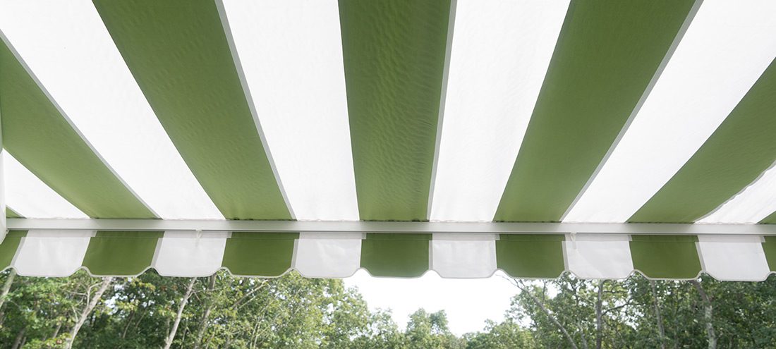 A green and white awning from underneath
