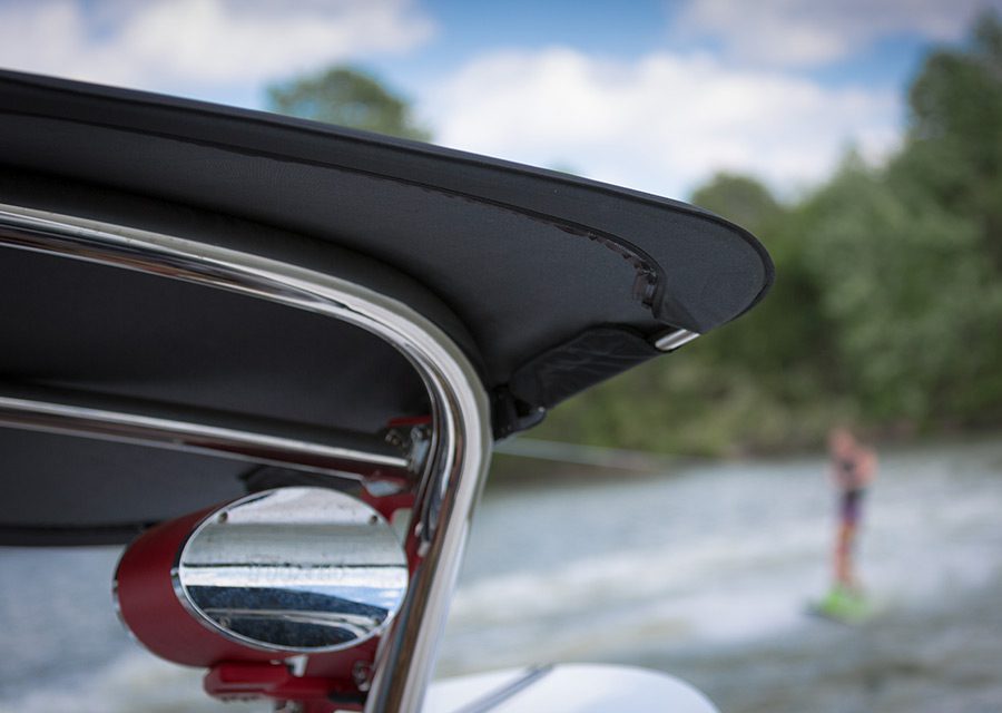 Boat cover with water skier in background