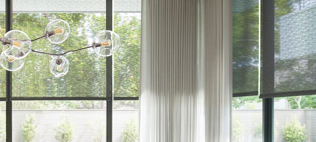 Window coverings on a room with floor to ceiling windows