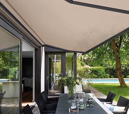 neutral awning over patio dining table and chairs