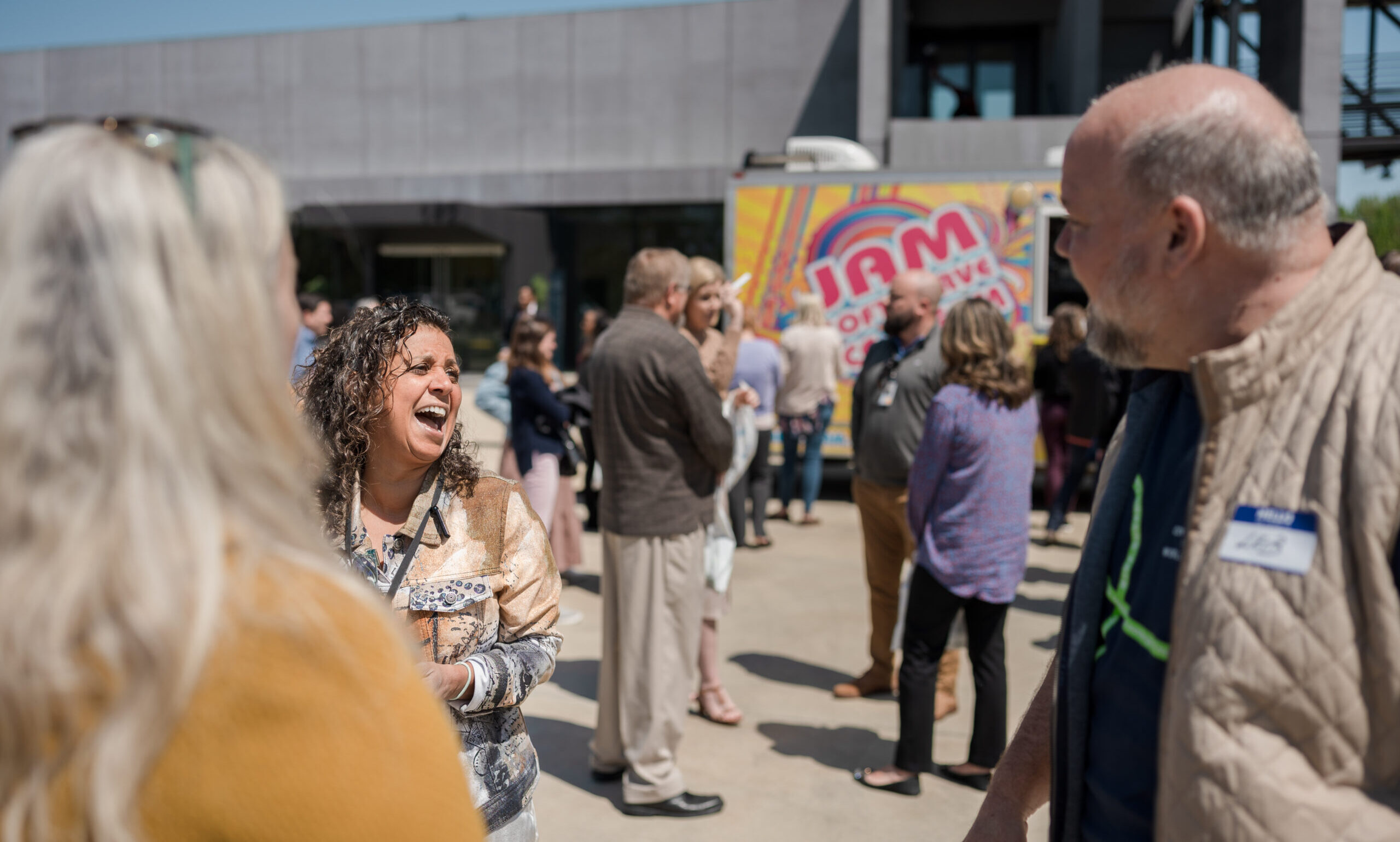 CEO Leib Oehmig talks with a woman at Glen raven Connect Fest
