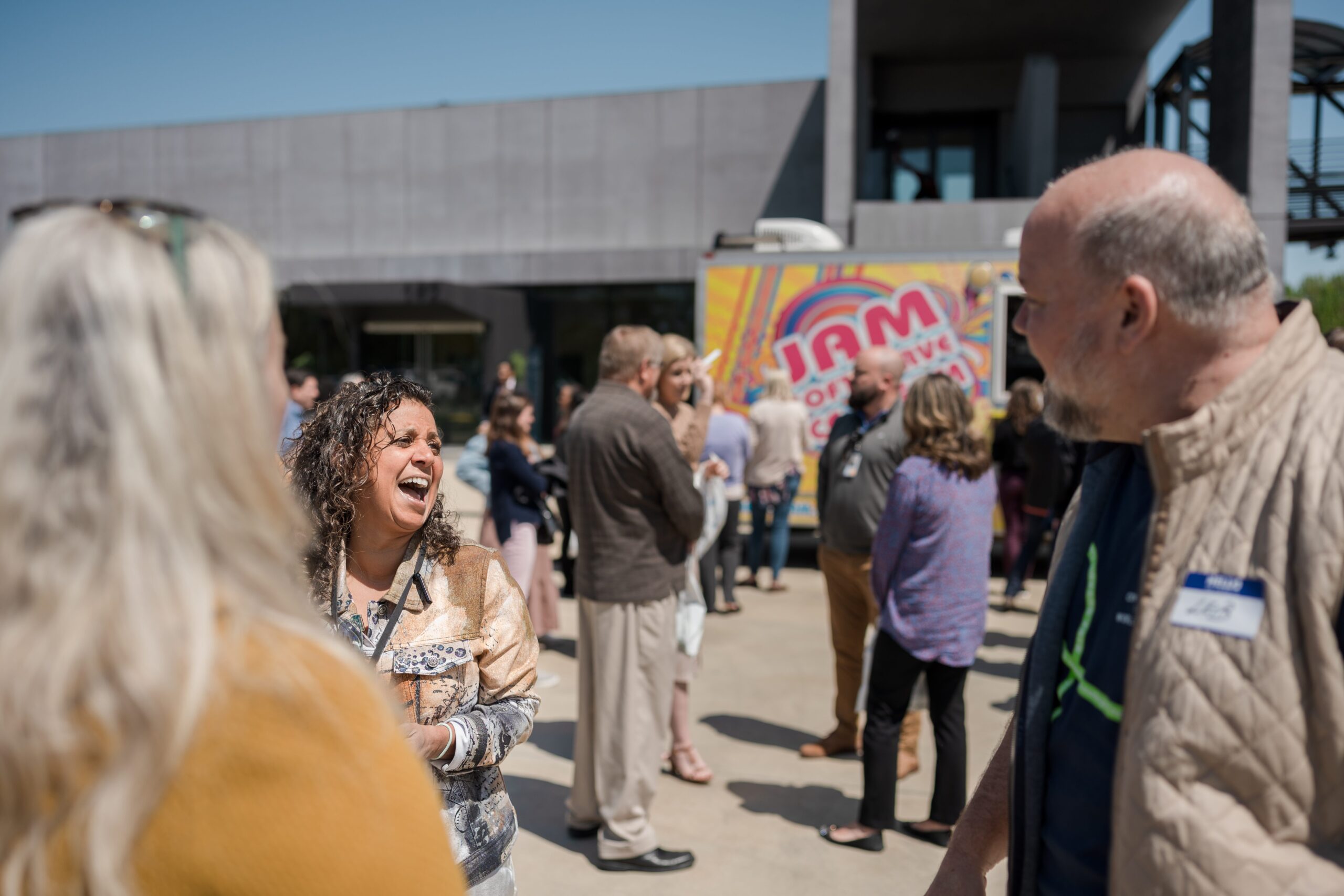 CEO Leib Oehmig talks with a woman at Glen raven Connect Fest