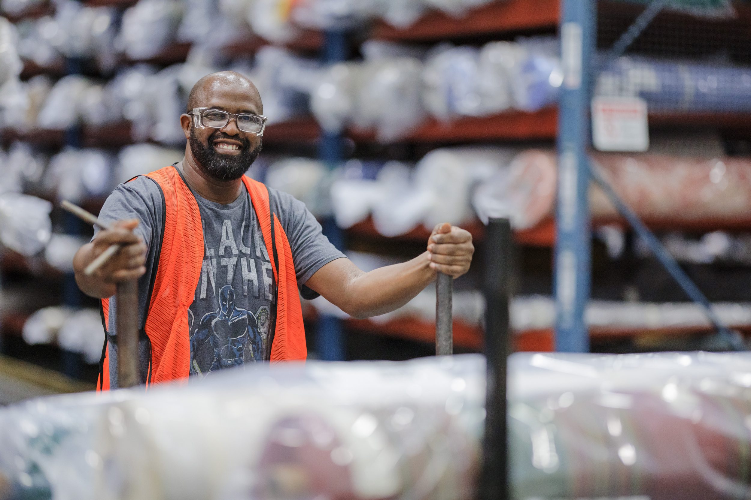 male factory employee smiling at camera