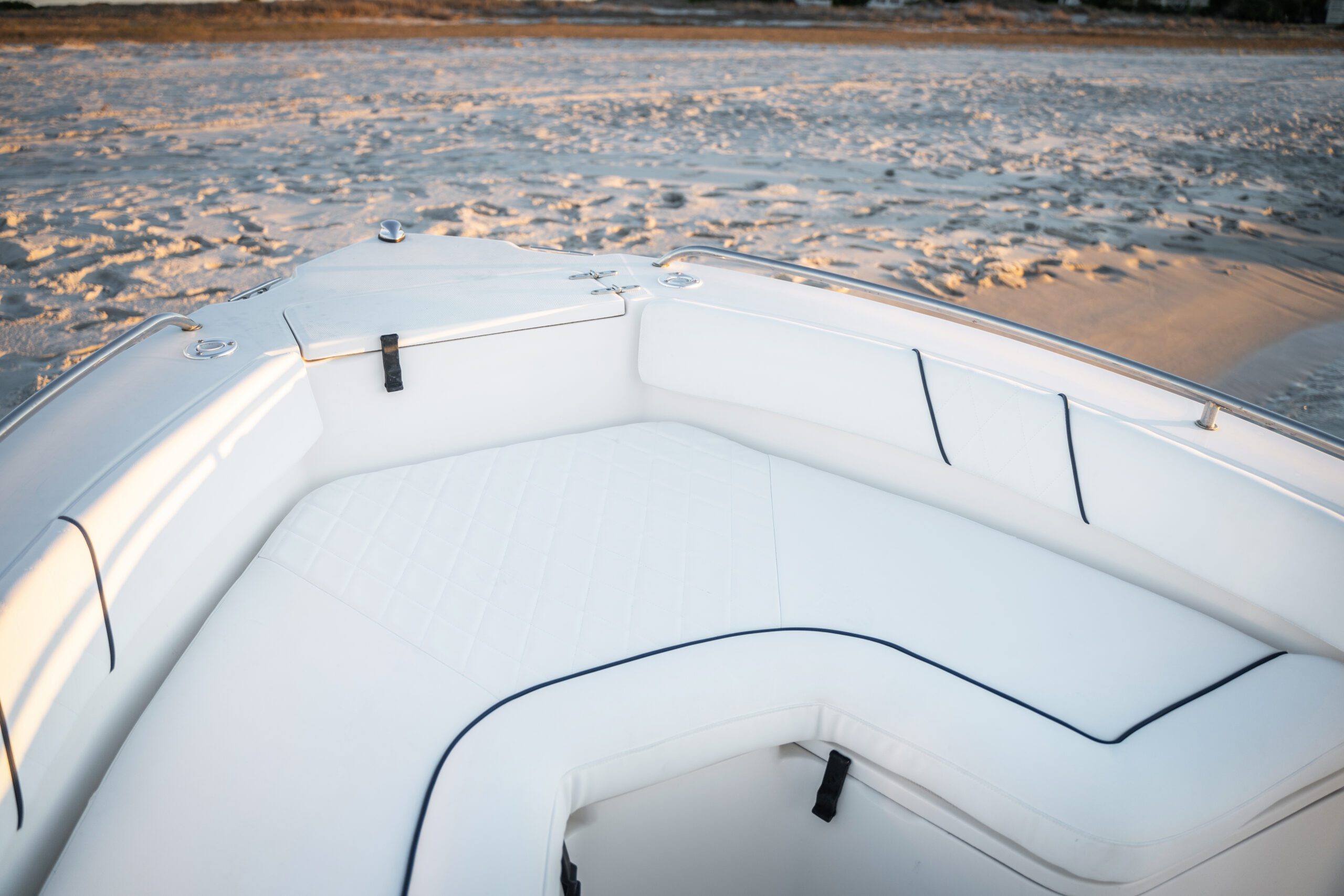 white fabric on the seats in the bow of a boat